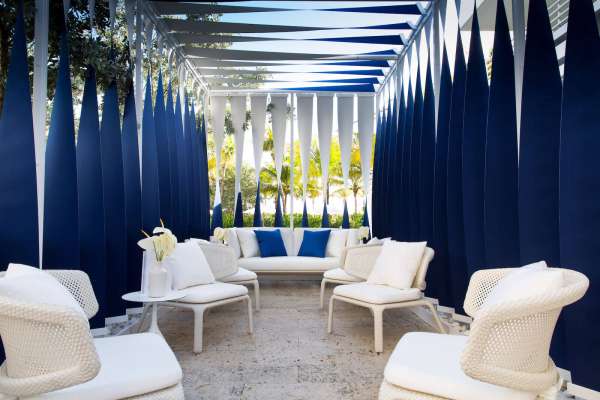 Blue and white shade structure made with Sunbrella fabrics.