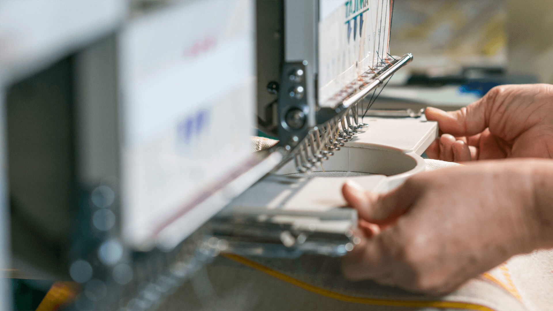 An embroidery machine with Sunbrella Embroidery Thread