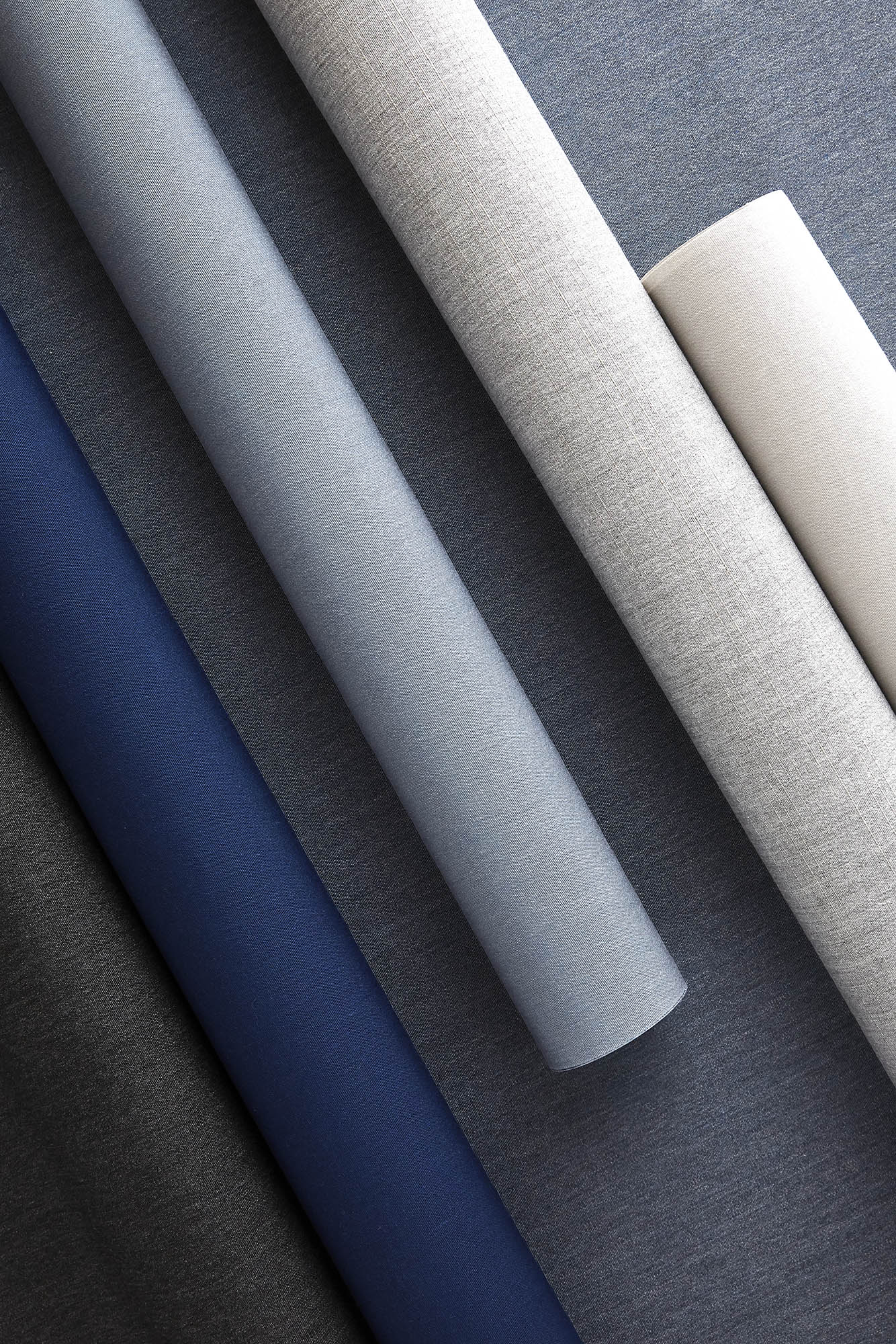 Sunbrella shade fabrics featuring the new solids of Cloud, Midnight and Slate Blue