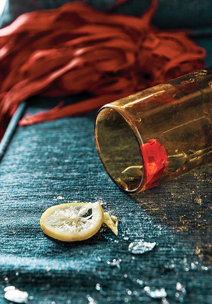 Close-up of cushion with spilled drink with lemon.